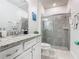 Bathroom with granite countertop, white cabinets, and a shower at 3798 Lana Ave, Davenport, FL 33897