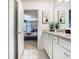 Bathroom with granite countertop, white cabinets, and shower at 3798 Lana Ave, Davenport, FL 33897