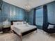 Bedroom with a dark-blue wall, a queen bed, and a cozy armchair at 3798 Lana Ave, Davenport, FL 33897