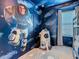 bedroom with Toy Story mural, bunk beds, and rocket playhouse at 3798 Lana Ave, Davenport, FL 33897