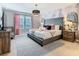 Main bedroom with king-size bed and stylish decor at 3798 Lana Ave, Davenport, FL 33897