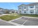 Two-story townhome with gray siding, landscaped lawn, and driveway parking at 3798 Lana Ave, Davenport, FL 33897