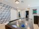 Game room with air hockey table and geometric wallcovering at 3798 Lana Ave, Davenport, FL 33897