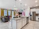 Spacious kitchen with granite island, stainless steel appliances, and white cabinets at 3798 Lana Ave, Davenport, FL 33897