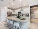 Open concept kitchen with large island, white cabinets, and stainless steel appliances at 3798 Lana Ave, Davenport, FL 33897