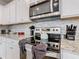 Modern kitchen with granite countertops and stainless steel appliances at 3798 Lana Ave, Davenport, FL 33897