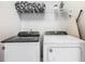 Laundry room with washer, dryer, and shelving for storage at 3798 Lana Ave, Davenport, FL 33897