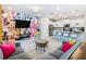 Open living space with colorful mural, kitchen, and comfortable seating at 3798 Lana Ave, Davenport, FL 33897