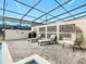 Covered patio with lounge chairs near a refreshing pool and spa at 3798 Lana Ave, Davenport, FL 33897