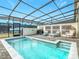 Private screened pool and spa with patio furniture and grill at 3798 Lana Ave, Davenport, FL 33897