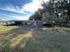 Ranch-style home with a large yard and carport at 423 Longfellow Blvd, Lakeland, FL 33801