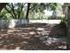 Backyard featuring a chain link fence and mature trees at 423 Longfellow Blvd, Lakeland, FL 33801