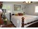 Bedroom with a decorative ceiling fan and an upholstered bed with several pillows at 423 Longfellow Blvd, Lakeland, FL 33801