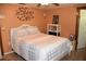 Cozy bedroom features tiled floors, neutral decor, and comfortable queen bed at 423 Longfellow Blvd, Lakeland, FL 33801