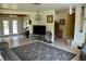 Open living room with tv, desk and exterior access with french doors at 423 Longfellow Blvd, Lakeland, FL 33801