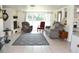 Living room with a large rug, fireplace and a large window for natural light at 423 Longfellow Blvd, Lakeland, FL 33801