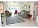 Living room with a large rug, fireplace and a large window for natural light at 423 Longfellow Blvd, Lakeland, FL 33801
