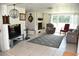 Living room with a large rug, fireplace and a large window for natural light at 423 Longfellow Blvd, Lakeland, FL 33801