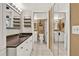 Clean bathroom with a walk-in shower, granite vanity and tiled floor at 4411 Sea Mist Ct # 174, New Smyrna Beach, FL 32169