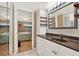 Bathroom with a granite vanity and mirrored closet doors at 4411 Sea Mist Ct # 174, New Smyrna Beach, FL 32169