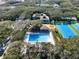 Resort-style pool with spacious deck and tennis courts at 4411 Sea Mist Ct # 174, New Smyrna Beach, FL 32169