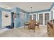 Bright dining room with a round table and four chairs, near entryway at 4411 Sea Mist Ct # 174, New Smyrna Beach, FL 32169