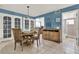 Open dining area with a round table and four chairs, near kitchen at 4411 Sea Mist Ct # 174, New Smyrna Beach, FL 32169