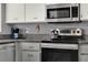 Modern kitchen features stainless steel appliances and granite countertops at 4411 Sea Mist Ct # 174, New Smyrna Beach, FL 32169