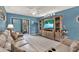 Spacious living room featuring a large TV and comfortable seating at 4411 Sea Mist Ct # 174, New Smyrna Beach, FL 32169
