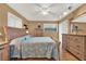 Main bedroom with light wood furniture and a ceiling fan at 4411 Sea Mist Ct # 174, New Smyrna Beach, FL 32169