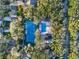 Community tennis court nestled in lush greenery at 4411 Sea Mist Ct # 174, New Smyrna Beach, FL 32169