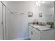 Clean and modern bathroom with a single vanity, mirror, and a glass-door shower at 4800 Memories Ln, Kissimmee, FL 34746