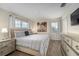 Comfortable bedroom with a cozy bed, stylish furniture, and plenty of natural light at 4800 Memories Ln, Kissimmee, FL 34746