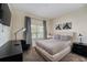 Comfortable bedroom featuring a large bed, soft carpet, and tasteful decorations at 4800 Memories Ln, Kissimmee, FL 34746