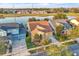 Beautiful landscaping and a view of the neighborhood lake are visible in this aerial view at 4912 Atwood Dr, Orlando, FL 32828