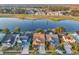 This aerial view shows the back of the home near a beautiful lake with other homes nearby at 4912 Atwood Dr, Orlando, FL 32828