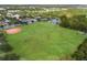 Expansive athletic field with baseball diamond and soccer field, complemented by tennis courts and lush greenery at 4912 Atwood Dr, Orlando, FL 32828