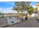 Brick patio with a sand box, mature trees, and beautiful lake views provide a relaxing outdoor space at 4912 Atwood Dr, Orlando, FL 32828