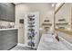 This bathroom features a marble countertop, modern sink, and convenient storage on the door at 4912 Atwood Dr, Orlando, FL 32828