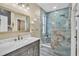 This bathroom features a marble countertop, a modern sink, and a beautifully tiled shower at 4912 Atwood Dr, Orlando, FL 32828