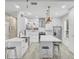 Modern kitchen with white marble countertops, stainless steel appliances, and pendant lighting at 4912 Atwood Dr, Orlando, FL 32828