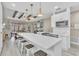 Bright kitchen featuring a large island, pendant lighting, modern appliances, and decorative ceiling beams at 4912 Atwood Dr, Orlando, FL 32828