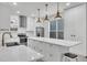Bright, modern kitchen with stainless steel appliances, a center island, white cabinetry and stylish countertops at 4912 Atwood Dr, Orlando, FL 32828