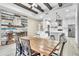 Spacious open-concept kitchen and dining with white cabinets, stainless appliances, island seating, and stylish decor at 4912 Atwood Dr, Orlando, FL 32828