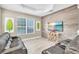 Living room showcasing a wood accent wall, a TV, and stylish, neutral furniture at 4912 Atwood Dr, Orlando, FL 32828