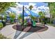 Brightly shaded playground with slides, climbing structures, and rubber mulch surfacing, surrounded by landscaping at 4912 Atwood Dr, Orlando, FL 32828