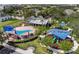 Community playground with splashpad, picnic tables, and covered playground equipment at 4912 Atwood Dr, Orlando, FL 32828