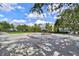 Charming town square with a water fountain feature, surrounded by businesses and green space at 4912 Atwood Dr, Orlando, FL 32828
