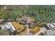 Luxury home surrounded by lush trees and landscaping at 506 Yellow Submarine Ct, Groveland, FL 34737