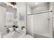 Clean bathroom with white subway tiles, bathtub, and marble vanity at 506 Yellow Submarine Ct, Groveland, FL 34737